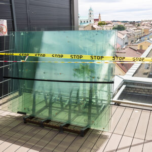 Custom Hurricane Windows for Retail Spaces Maximizing Display and Protection, pallet with window glasses in front of new build